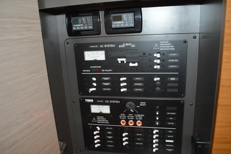 Slide: The Image of Electrical control panel on 2024 Tiara Yachts 34 LS, featuring AC and DC systems. - 71