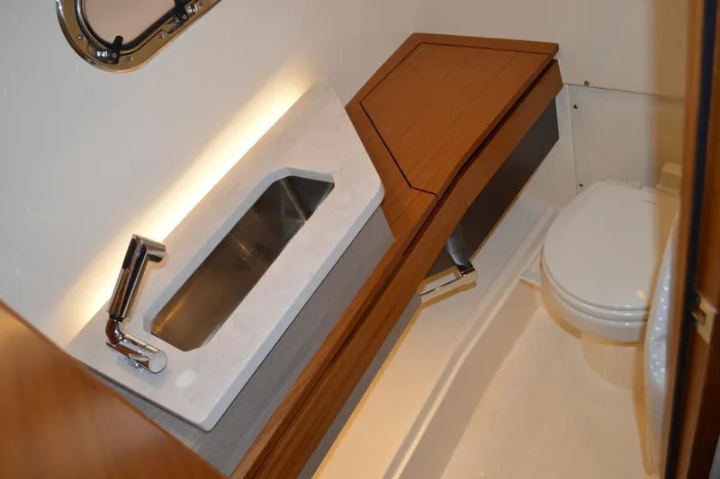 Slide: The Image of 2024 Tiara Yachts 34 LS bathroom with modern sink and toilet. - 74