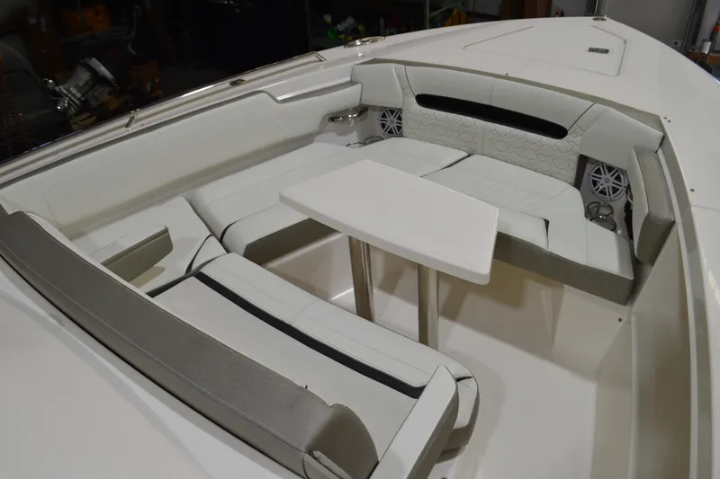 Slide: The Image of 2024 Tiara Yachts 34 LS interior with white seating and table. - 9