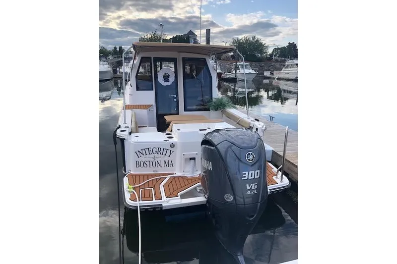 Slide: The Image of 2023 Ranger Tugs R-27 boat docked, featuring Yamaha 300 V6 engine, Boston, MA. - 5
