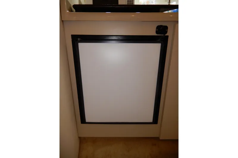 Slide: The Image of 1999 Cruisers Yachts 3075 Rogue interior refrigerator, compact and sleek design. - 29