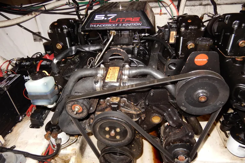 Slide: The Image of Engine of a 1999 Cruisers Yachts 3075 Rogue, featuring a 5.7 Litre Thunderbolt V8 ignition system. - 46