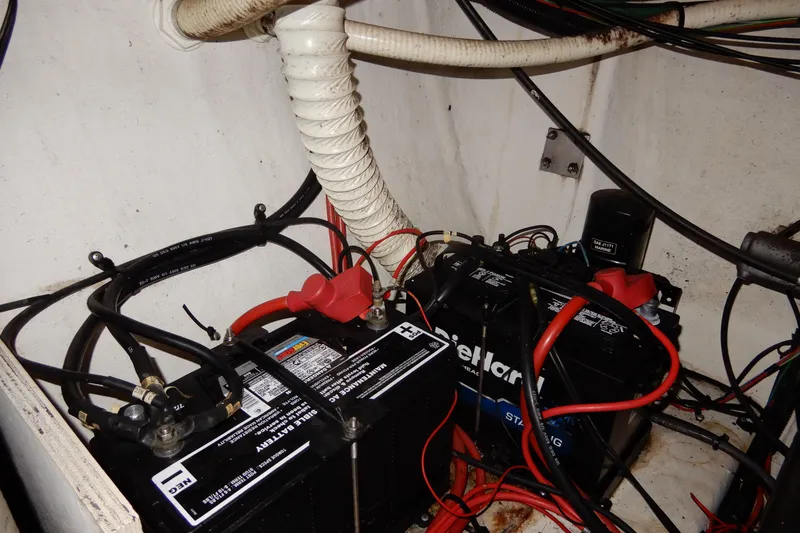 Slide: The Image of Battery compartment of 1999 Cruisers Yachts 3075 Rogue with wiring and connections. - 50