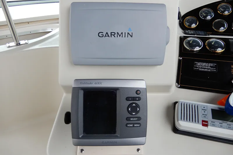 Slide: The Image of Garmin Fishfinder 400C on 1999 Cruisers Yachts 3075 Rogue dashboard with gauges. - 18