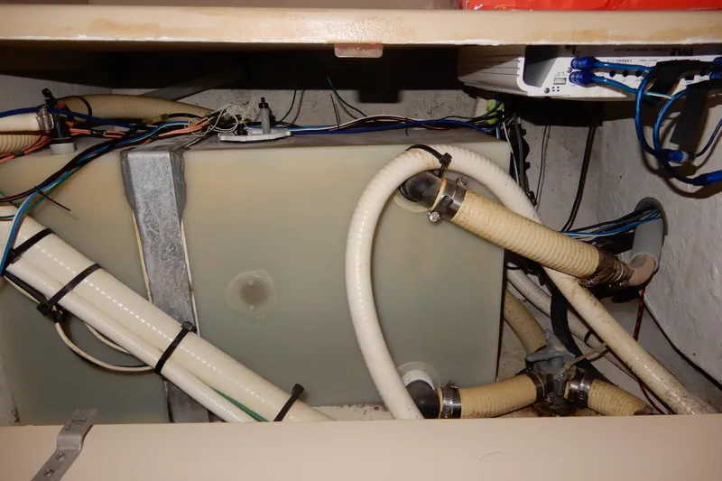 Slide: The Image of 1999 Cruisers Yachts 3075 Rogue plumbing system with hoses and wiring. - 39