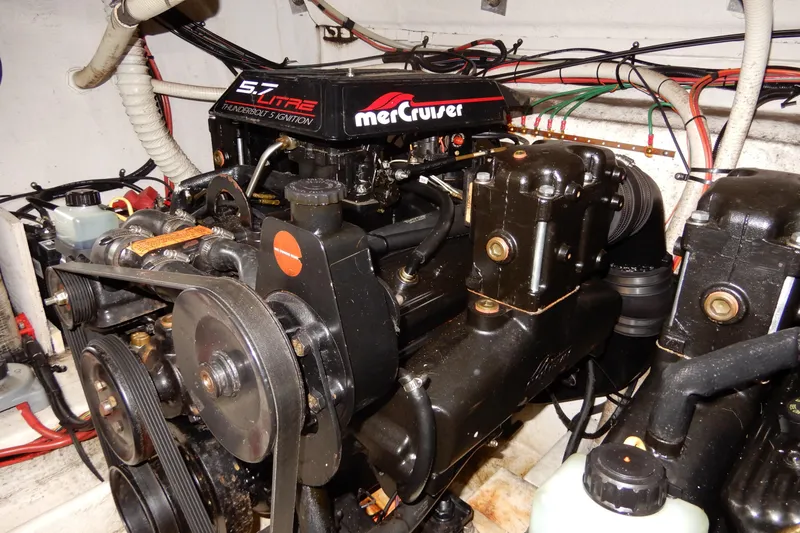 Slide: The Image of Engine compartment of a 1999 Cruisers Yachts 3075 Rogue with MerCruiser 5.7L engine. - 48