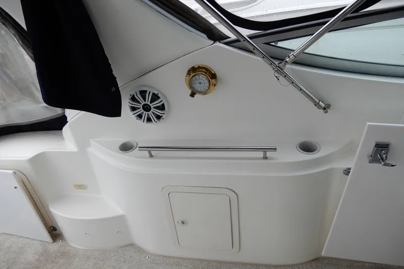 Slide: The Image of 1999 Cruisers Yachts 3075 Rogue interior with speaker, barometer, and window details. - 9