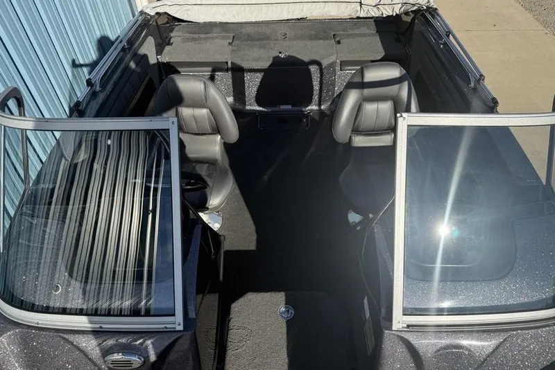 Slide: The Image of 2014 Stratos 386 XF boat interior with dual seats and windshield. - 18