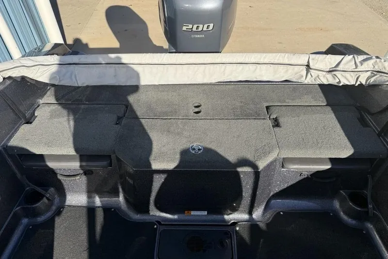 Slide: The Image of 2014 Stratos 386 XF boat interior with Yamaha 200 engine, showing storage compartments. - 19