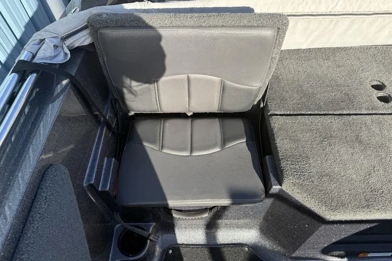 Slide: The Image of 2014 Stratos 386 XF boat seat with gray upholstery and carpeted flooring. - 25