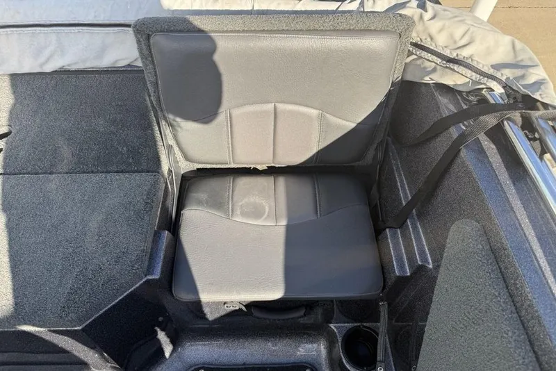 Slide: The Image of 2014 Stratos 386 XF boat seat with gray upholstery and cup holder. - 26