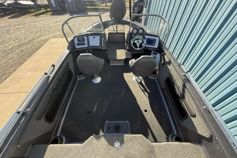 Slide: The Image of 2014 Stratos 386 XF boat interior with dual seats and control panel. - 27