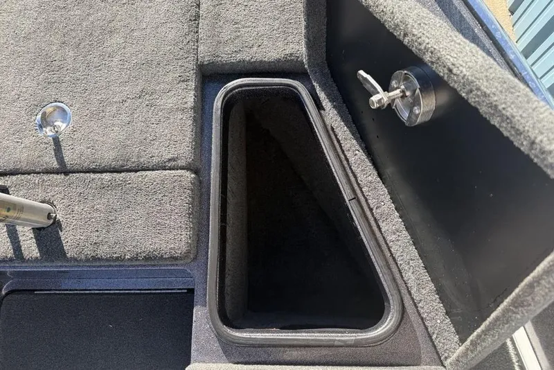 Slide: The Image of Carpeted storage compartment in a 2014 Stratos 386 XF boat interior. - 7