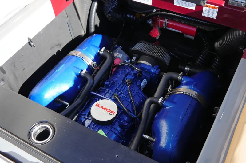 Slide: The Image of Engine compartment of a 2022 MasterCraft XT23 boat featuring an Ilmor engine. - 13