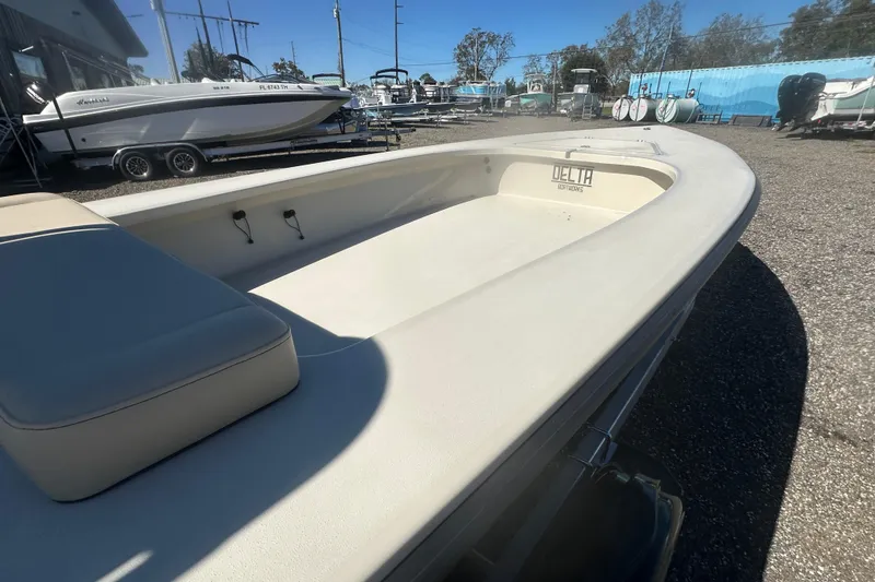 Slide: The Image of 2026 Delta Boatworks Delta D18 in a boatyard, showcasing sleek design and spacious interior. - 13