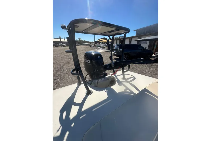 Slide: The Image of 2026 Delta Boatworks Delta D18 with Suzuki outboard motor in a sunny outdoor setting. - 16