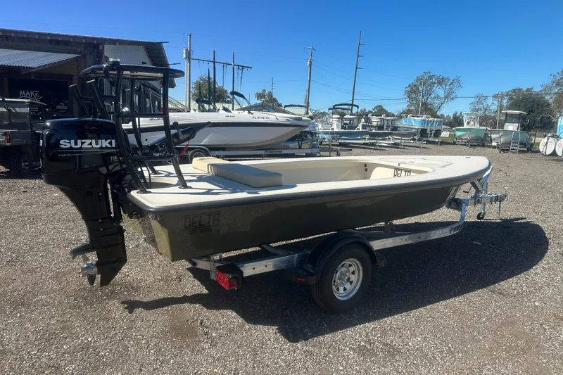Slide: The Image of 2026 Delta Boatworks Delta D18 with Suzuki motor on trailer in boatyard. - 6