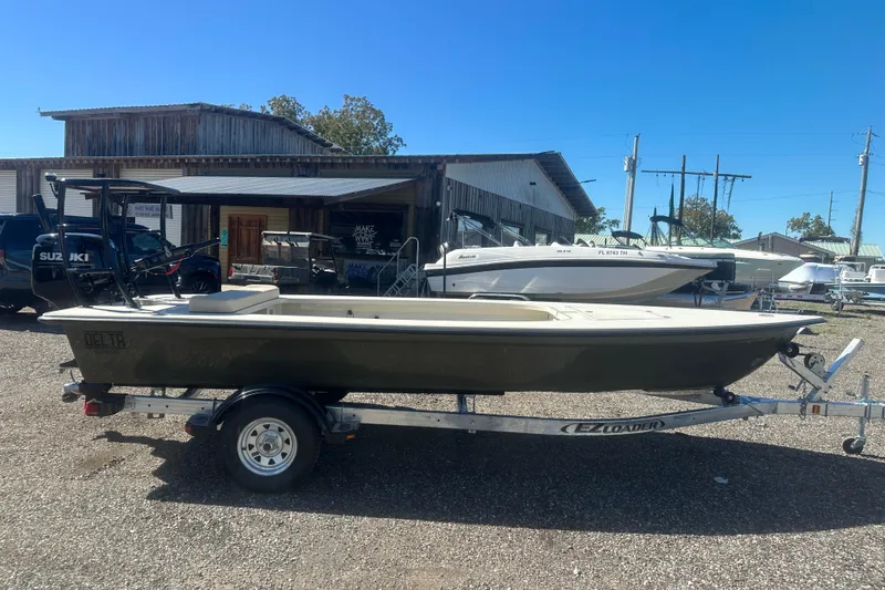 Slide: The Image of 2026 Delta Boatworks Delta D18 on trailer, parked outdoors under clear blue sky. - 7