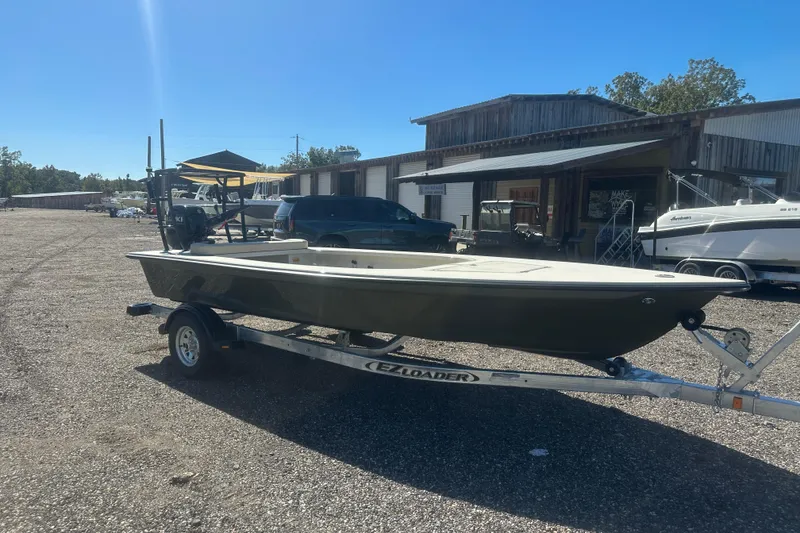 Slide: The Image of 2026 Delta Boatworks Delta D18 on trailer, parked outdoors under clear blue sky. - 8