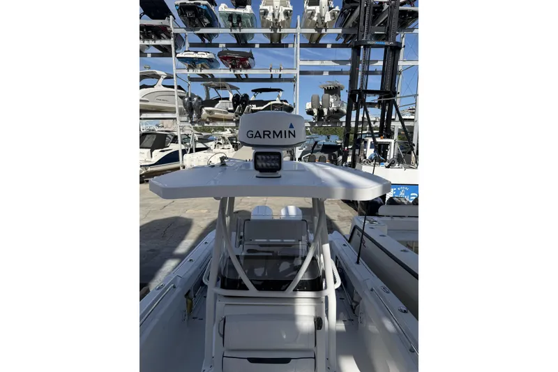 Slide: The Image of 2021 Blackfin 252 CC boat anchor compartment with storage and equipment. - 17