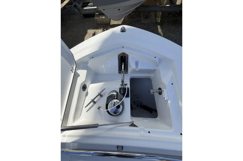 Slide: The Image of 2021 Blackfin 252 CC boat with dual Mercury outboard engines in a marina setting. - 19