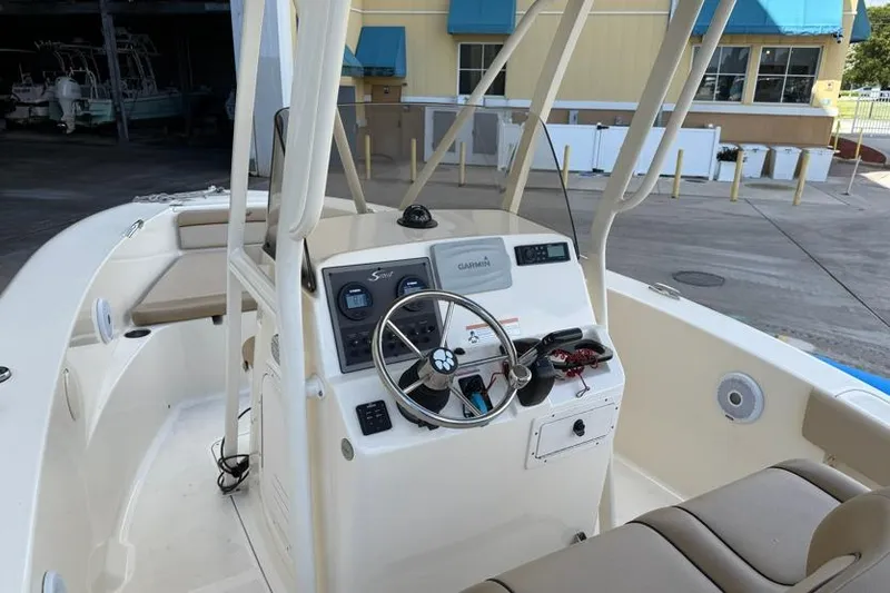 Slide: The Image of 2017 Scout 195 Sportfish boat interior with steering console and seating. - 6