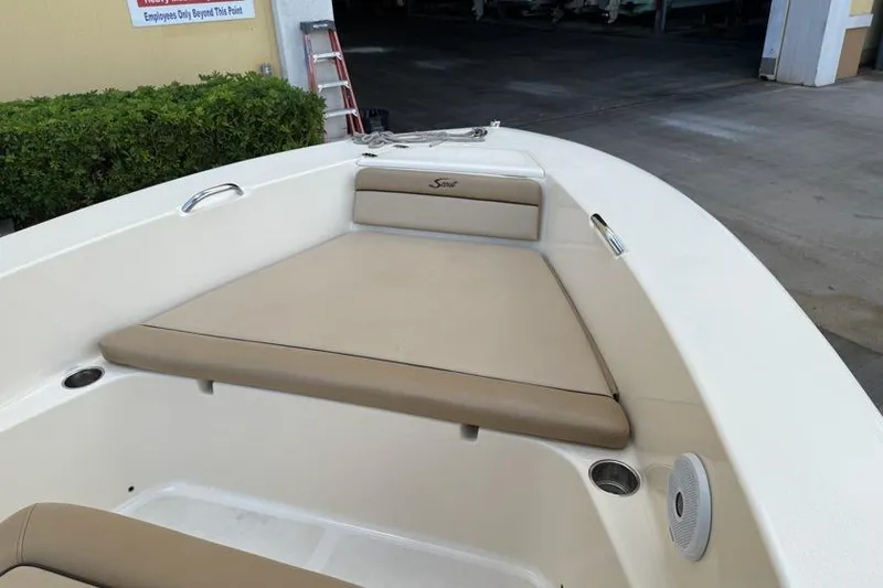 Slide: The Image of 2017 Scout 195 Sportfish boat interior with beige seating and cup holders. - 8