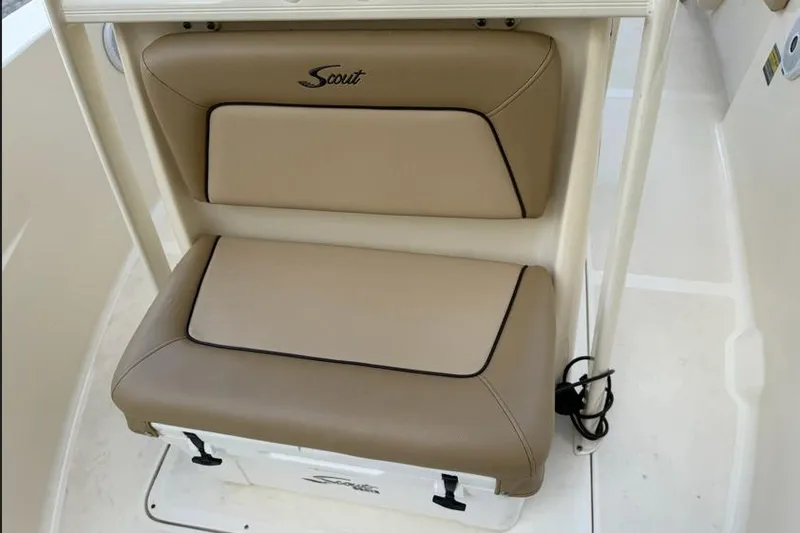 Slide: The Image of 2017 Scout 195 Sportfish boat seat with tan cushions and Scout logo. - 9