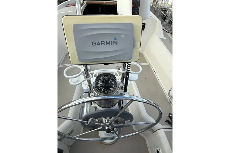 Slide: The Image of Cockpit of 1983 O'Day 34 sailboat with Garmin navigation system and compass. - 10
