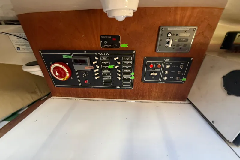 Slide: The Image of Interior of 1983 O'Day 34 sailboat with green-striped cushions in cabin. - 33