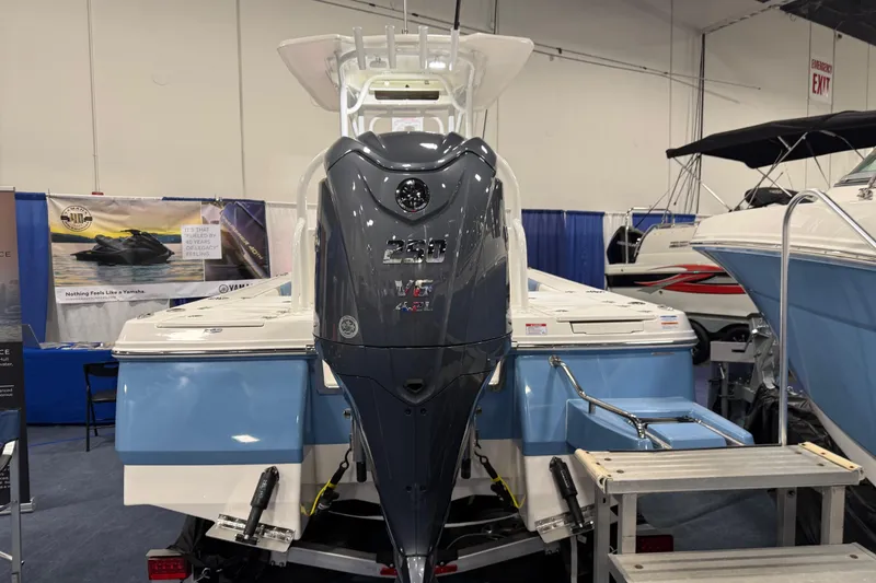 Slide: The Image of Manufacturer Provided Image: 2025 Robalo 226 Cayman boat, rear view, featuring powerful outboard motor, sleek design. - 18