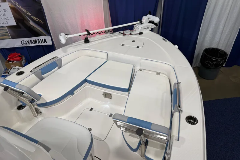 Slide: The Image of Manufacturer Provided Image: 2025 Robalo 226 Cayman boat interior with seating and storage compartments. - 19