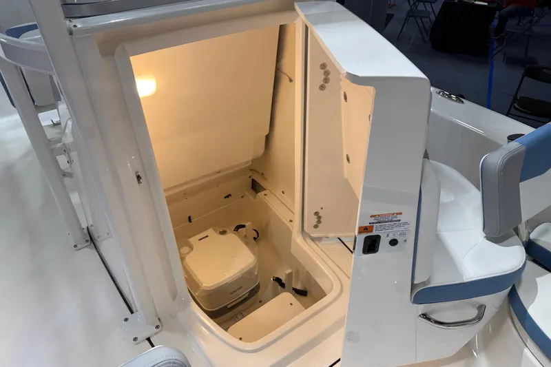 Slide: The Image of Manufacturer Provided Image: 2025 Robalo 226 Cayman boat interior with cushioned seating and sleek design. - 21