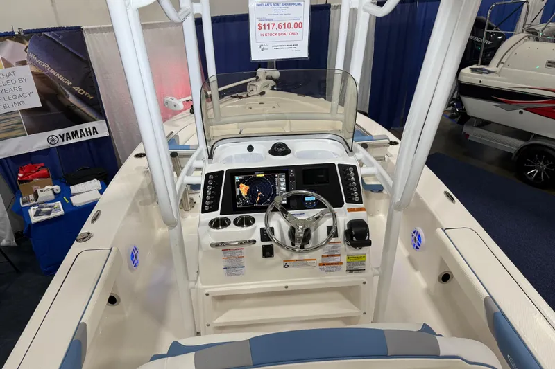 Slide: The Image of Manufacturer Provided Image: 2025 Robalo 226 Cayman boat interior storage compartment with open door. - 26