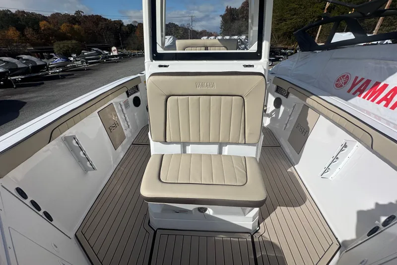 Slide: The Image of 2026 Yamaha Boats 222 FSH Sport E interior with beige seating and sleek design. - 17