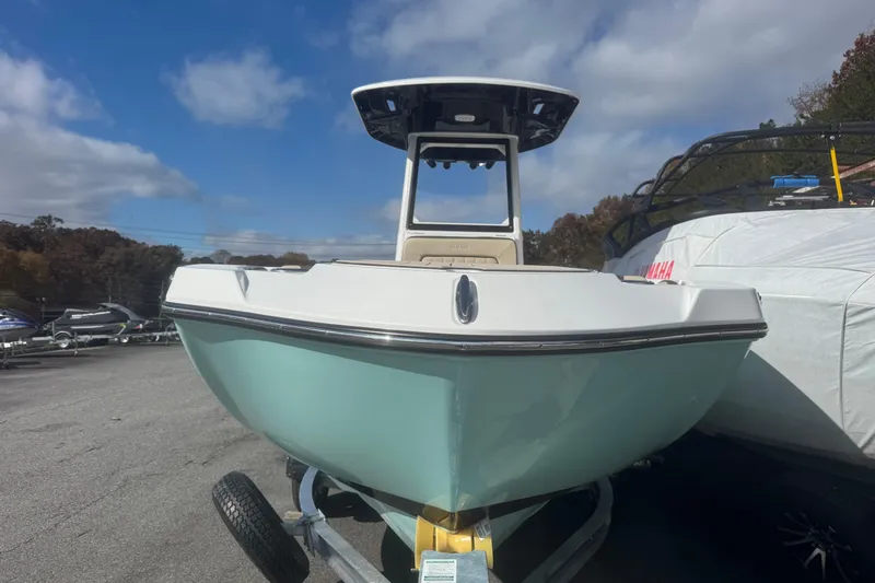Slide: The Image of 2026 Yamaha Boats 222 FSH Sport E on trailer under blue sky. - 2