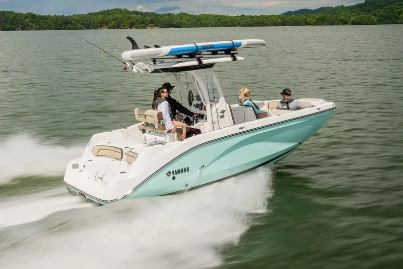 Slide: The Image of Manufacturer Provided Image: 2026 Yamaha Boats 222 FSH Sport E cruising on a lake with passengers onboard. - 6