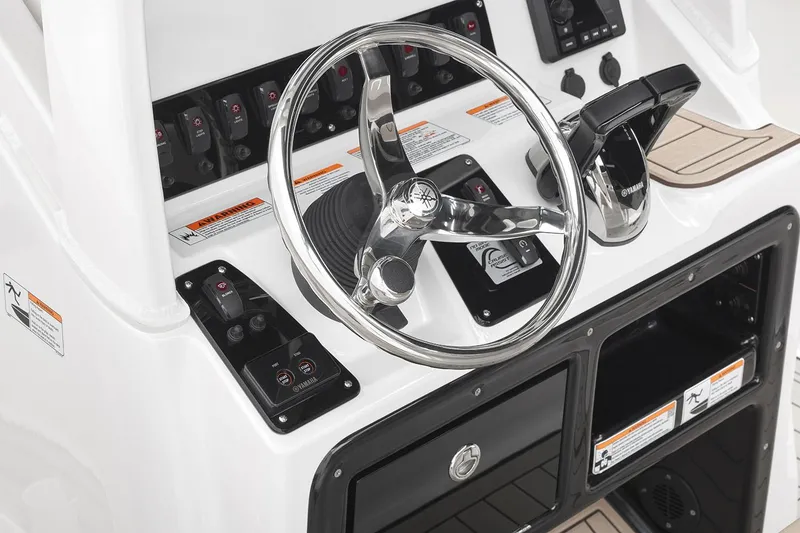 Slide: The Image of Manufacturer Provided Image: 2026 Yamaha Boats 222 FSH Sport E dashboard with steering wheel and controls. - 9