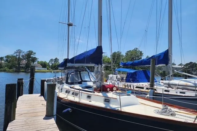 The Image of 1984 Bristol 45.5 Center Cockpit sailboat docked on a sunny day. - 0