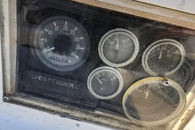 Slide: The Image of Dashboard gauges of a 1984 Bristol 45.5 Center Cockpit sailboat, featuring Westerbeke engine indicators. - 18