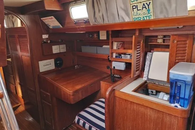 Slide: The Image of 1984 Bristol 45.5 Center Cockpit interior with wooden furnishings and nautical decor. - 27