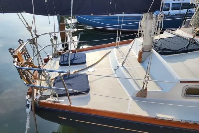 Slide: The Image of 1984 Bristol 45.5 Center Cockpit sailboat with cushioned seating and polished deck. - 3