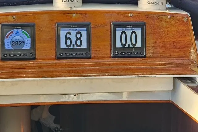 Slide: The Image of Bristol 45.5 Center Cockpit 1984 with Garmin navigation displays showing compass, depth, and speed. - 35