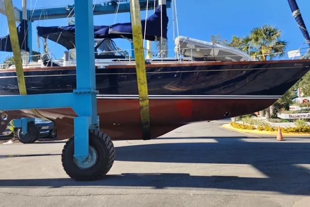 Slide: The Image of 1984 Bristol 45.5 Center Cockpit sailboat in dry dock, blue hull, sunny day. - 8