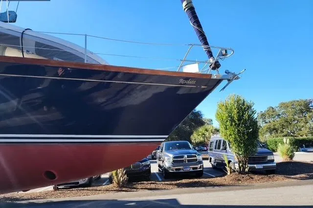 Slide: The Image of 1984 Bristol 45.5 Center Cockpit yacht in parking lot, blue hull, sunny day. - 9