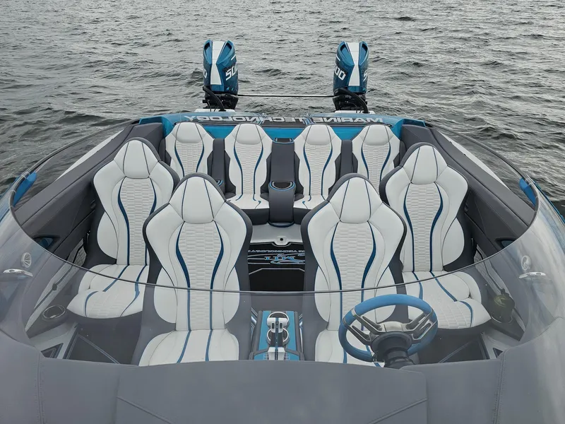 Slide: The Image of Luxury MTI 440X 2026 speedboat interior with white and blue seating on water. - 13