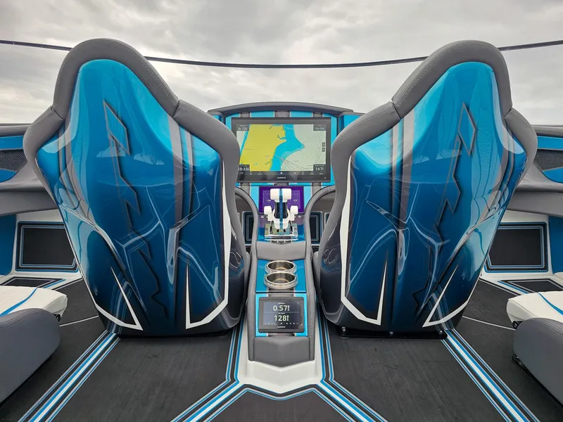Slide: The Image of Futuristic MTI 440X cockpit with advanced navigation system, blue seats, and sleek design, 2026 model. - 18