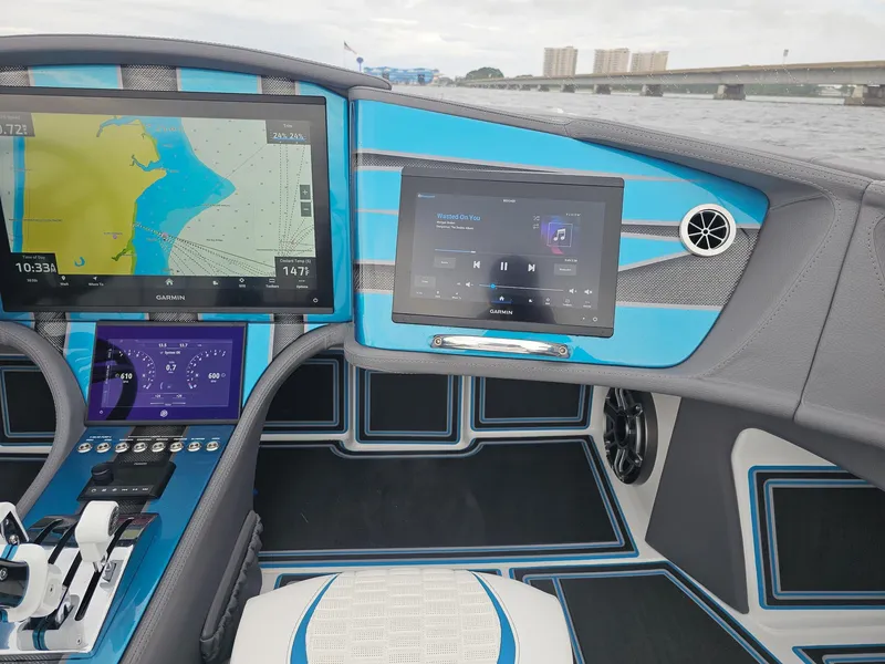 Slide: The Image of Dashboard of 2026 MTI 440X boat with navigation and audio displays. - 22