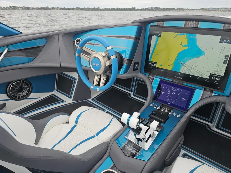 Slide: The Image of Interior of 2026 MTI 440X boat with advanced navigation system and stylish blue accents. - 23