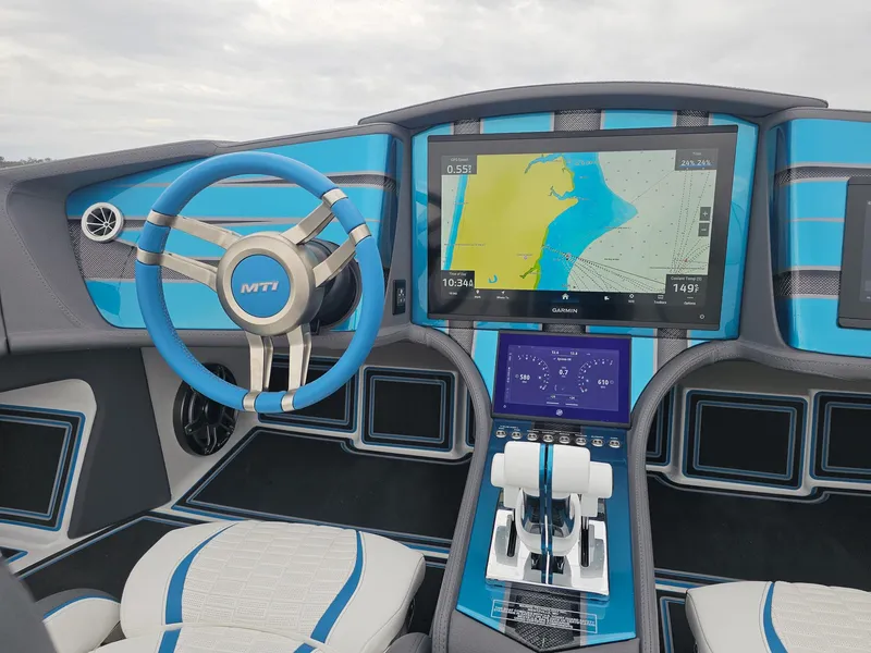 Slide: The Image of Interior of 2026 MTI 440X boat with advanced navigation system and blue accents. - 29